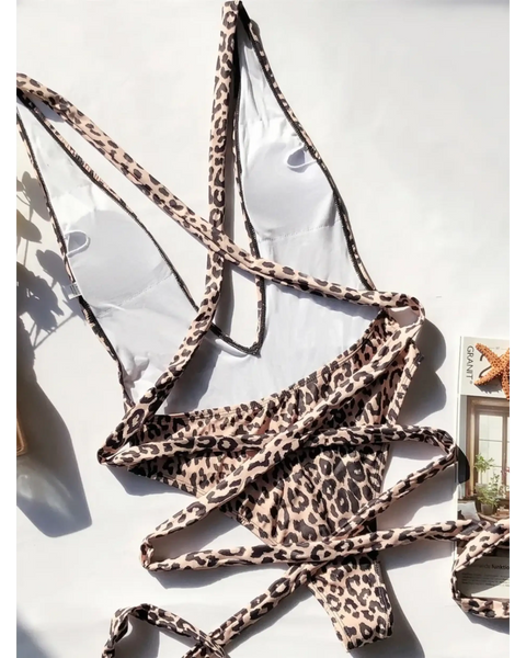 Beach Babes leopard print swimsuit for women with adjustable straps laid flat on white background