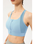 Babe Beachwaer light blue zip front sports bra with racerback design on a model