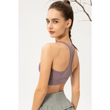 Babe Beachwear light blue zip front sports bra worn by model showing back design and fit