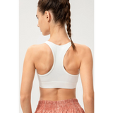Babe Beachwaer light blue zip front sports bra shown from the back on a model with racerback design