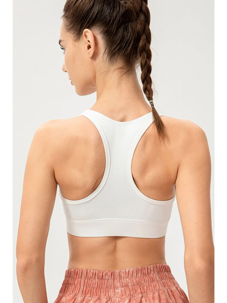 Babe Beachwaer light blue zip front sports bra shown from the back on a model with racerback design