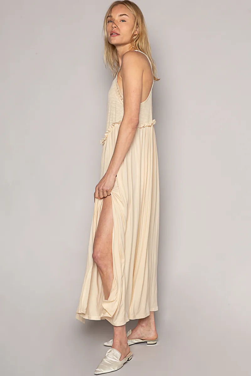 Trendsi lightweight beach party dress beige midi with side slit and spaghetti straps on model