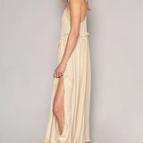 Trendsi lightweight beach party dress beige midi with side slit and spaghetti straps on model