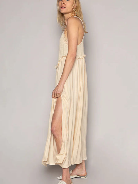 Trendsi lightweight beach party dress beige midi with side slit and spaghetti straps on model