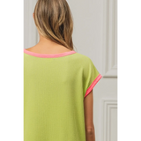 Back view of lime and pink sleeveless shirt by Trendsi with pink trim on sleeves and neckline