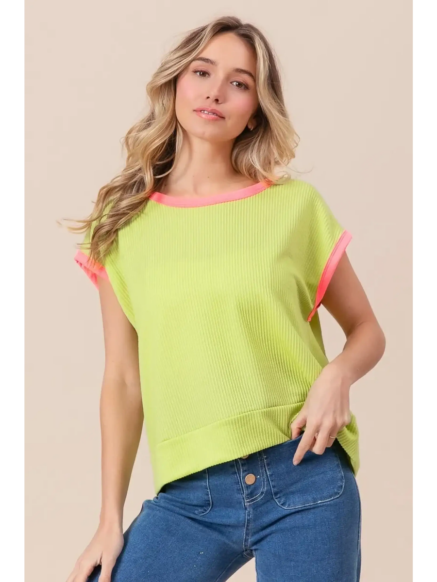 Trendsi lime and pink sleeveless shirt with ribbed texture worn by model with blue jeans