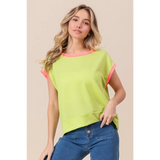 Trendsi lime and pink sleeveless shirt with ribbed texture worn by model with blue jeans