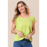 Trendsi lime and pink sleeveless shirt worn by smiling woman paired with blue jeans