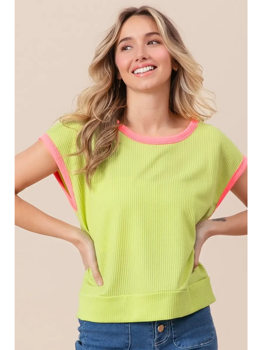 Trendsi lime and pink sleeveless shirt with ribbed texture worn by smiling woman
