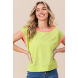 Trendsi lime and pink sleeveless shirt with ribbed texture worn by smiling woman