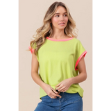 Trendsi lime and pink sleeveless shirt with ribbed texture worn by woman with loose waves