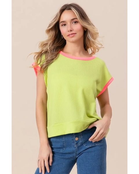 Trendsi lime and pink sleeveless shirt with ribbed texture and contrast trim worn by woman