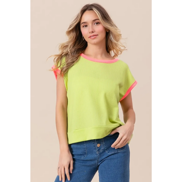Trendsi lime and pink sleeveless shirt with ribbed texture and contrast trim worn by woman