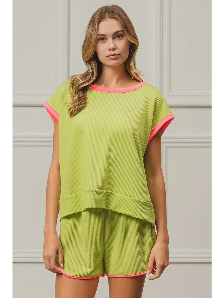 Trendsi lime and pink sleeveless shirt with relaxed fit and contrasting trim on a model