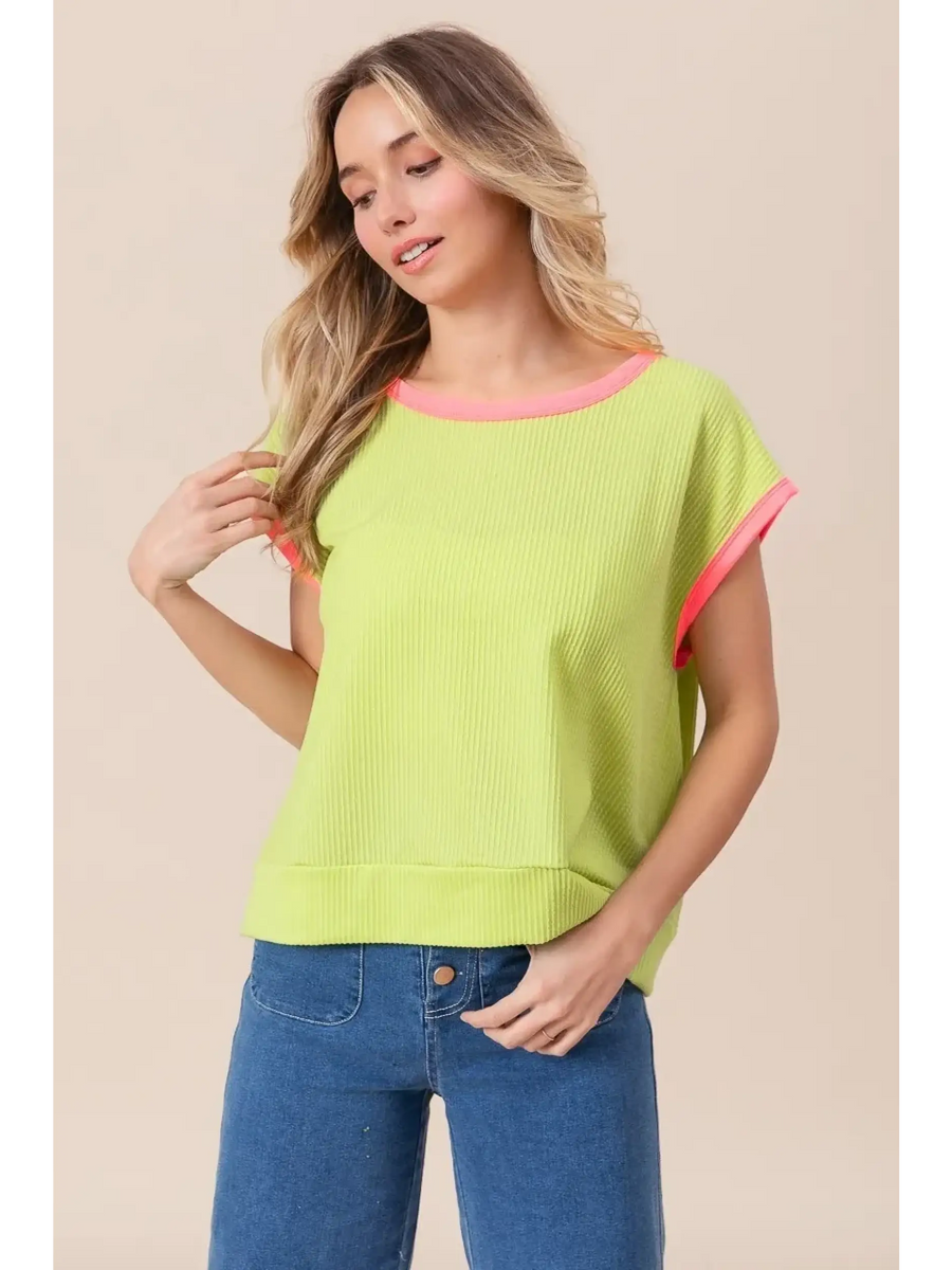 Trendsi lime and pink sleeveless shirt with ribbed texture and relaxed fit worn with blue jeans