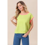 Trendsi lime and pink sleeveless shirt with ribbed texture and relaxed fit worn with blue jeans