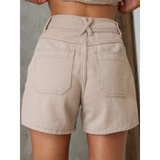 Back view of linen short set with button top featuring beige high-waisted shorts with pockets