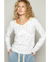 white long sleeve beachwear top with small floral print worn by model