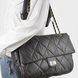 Babe Beachwear Look a Like Lambskin Flap Bag in black quilted design with chain strap