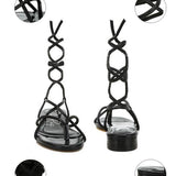 Rag Company black strappy sandals with rhinestone embellished laces and comfortable flat heel