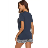 Babe Beachwear navy lounge shirt and short set with striped shorts worn by woman