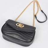 Babe Beachwear luxury GC Logo Chain Flap Bag in black with gold chain strap and quilted design
