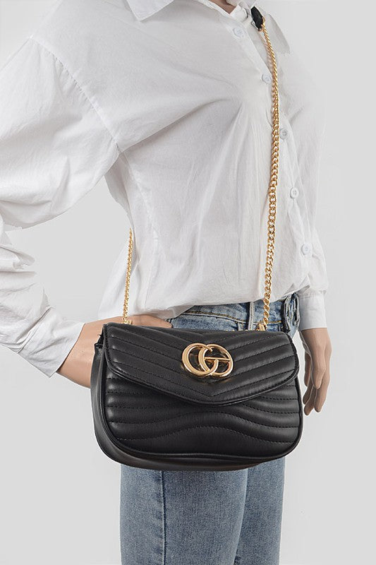 Luxury GC Logo Chain Flap Bag in black leather with gold hardware worn crossbody