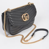 Luxury GC Logo Chain Flap Bag in black with gold chain strap and quilted design by Babe Beachwear