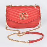 Luxury GC Logo Chain Flap Bag in red with gold chain strap and quilted design by Babe Beachwaer