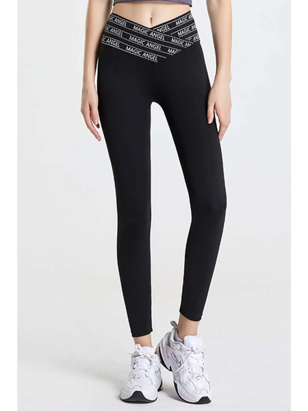 Babe Beachwear black high waisted workout leggings for women with branded waistband and white athletic shoes