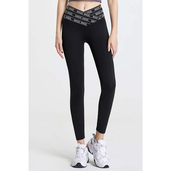 Babe Beachwear black high waisted workout leggings for women with branded waistband and white athletic shoes