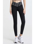 Babe Beachwear black high waisted workout leggings for women with branded waistband and white athletic shoes
