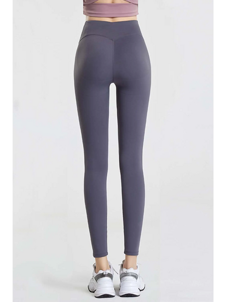 Babe Beachwaer high waisted workout leggings for women in dark gray shown from the back with white sneakers