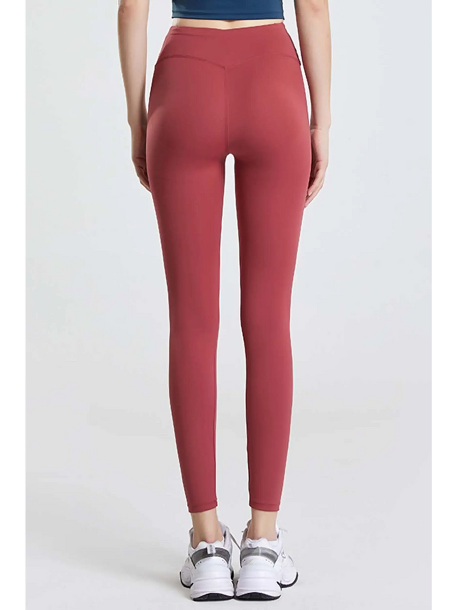 Babe Beachwaer high waisted workout leggings for women in red shown from the back with white sneakers