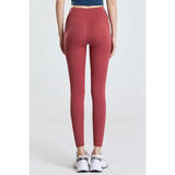Babe Beachwaer high waisted workout leggings for women in red shown from the back with white sneakers