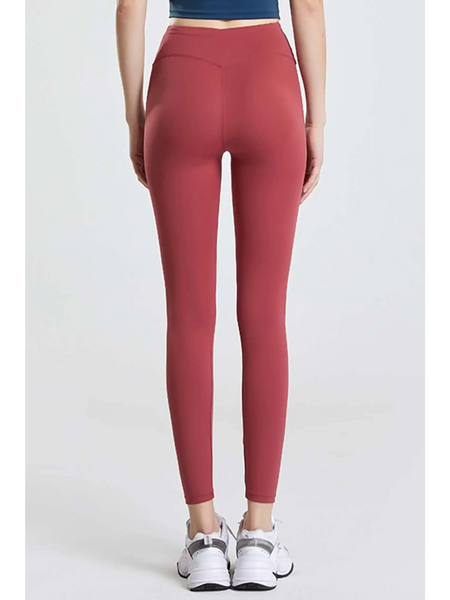 Babe Beachwaer high waisted workout leggings for women in red shown from the back with white sneakers