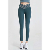 Babe Beachwear high waisted workout leggings for women in teal with logo waistband and white sneakers