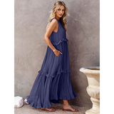Trendsi flowy pink ruffle maxi dress styled in navy blue with sleeveless design and tiered ruffles