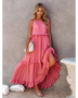woman in a long pink maxi dress in a pink garden with pink skyline