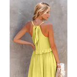 Trendsi flowy pink ruffle maxi dress shown from back with tie and ruffle detail