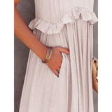 Close-up of flowy pink ruffle maxi dress by Trendsi showing side pocket and ruffle detail