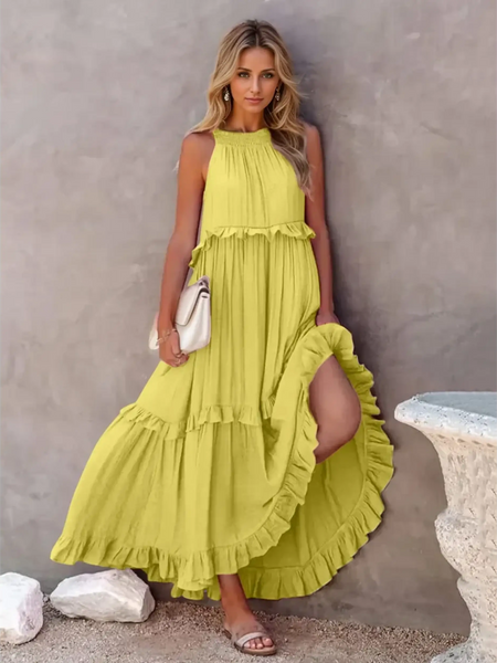 Trendsi flowy pink ruffle maxi dress styled with a white handbag and sandals