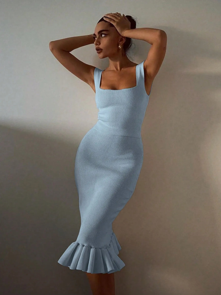 model wearing light blue ribbed maxi mermaid dress with square neckline and ruffled hem