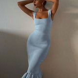 model wearing light blue ribbed maxi mermaid dress with square neckline and ruffled hem