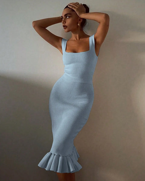 model wearing light blue ribbed maxi mermaid dress with square neckline and ruffled hem