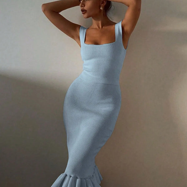 model wearing light blue ribbed maxi mermaid dress with square neckline and ruffled hem