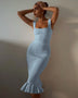 model wearing light blue ribbed maxi mermaid dress with square neckline and ruffled hem