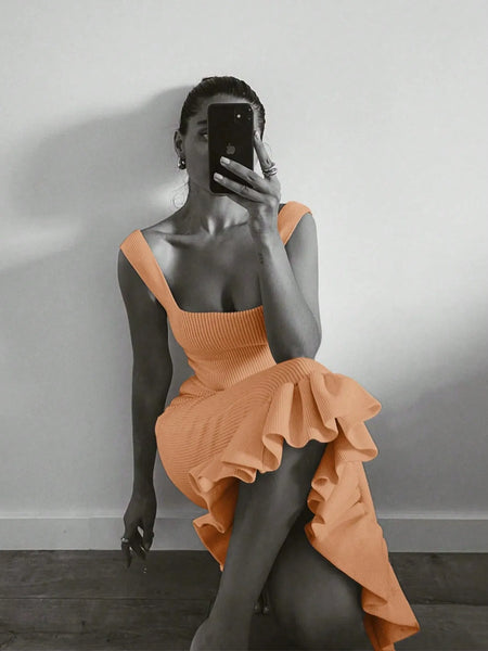 Trendsi orange maxi mermaid dress with ruffled hem and square neckline worn by woman taking a mirror selfie