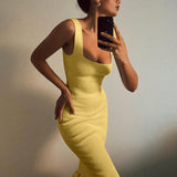 Trendsi yellow sleeveless ribbed maxi mermaid dress with ruffle hem worn by woman taking selfie
