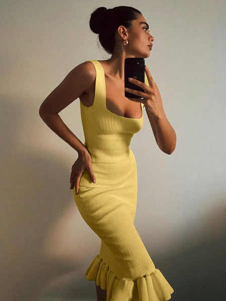 Trendsi yellow sleeveless ribbed maxi mermaid dress with ruffle hem worn by woman taking selfie